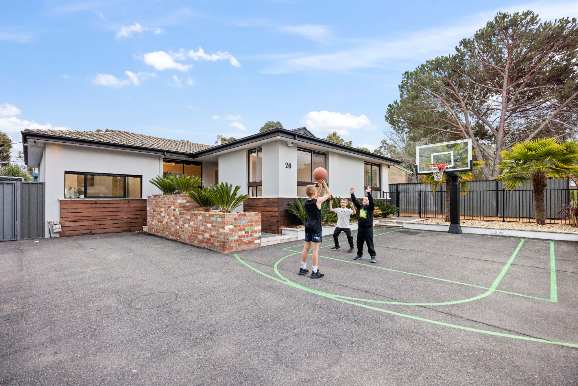 Josh Papalii's family home, listed with Jonny Warren Properties, features a front yard basketball court, perfect for active families.