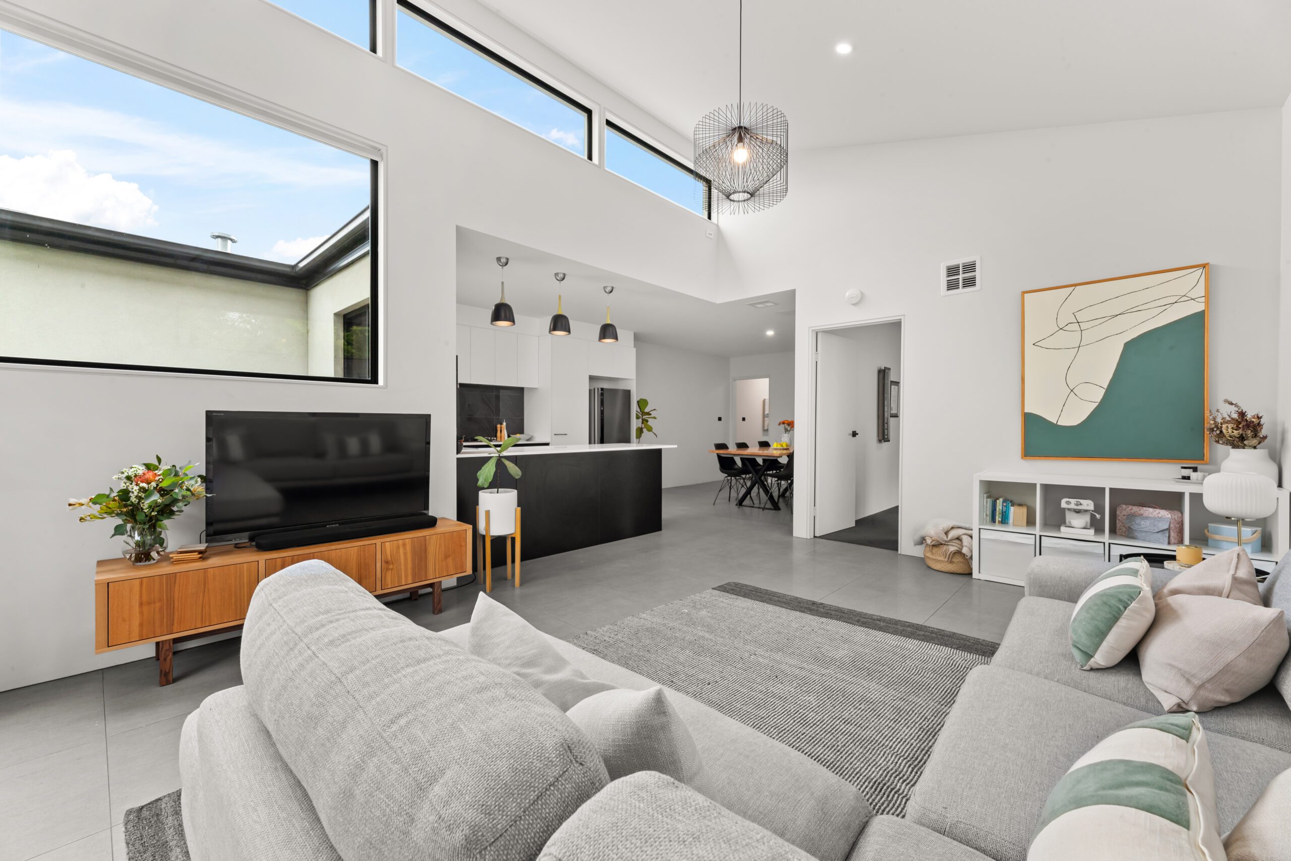 Spacious and stylish living room interior at 2/36 Larakia Street in Waramanga, showcasing Canberra’s vibrant summer property market.